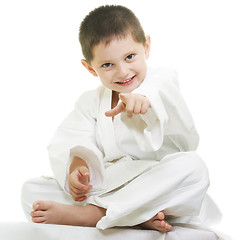 Image showing Little karate kid pointing forward