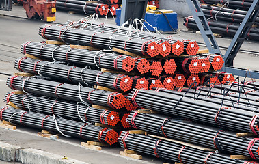 Image showing Stack of metal bars prepared for loading