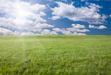 Image showing Green Grass Field, Blue Sky and Sun