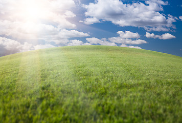 Image showing Green Grass Field, Blue Sky and Sun