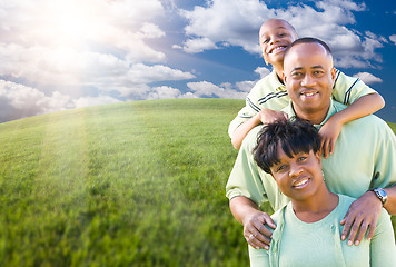 Image showing Family Over Clouds, Sky and Grass Field