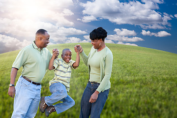 Image showing Family Over Clouds, Sky and Grass Field