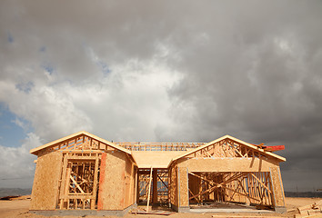 Image showing Abstract Home Construction Site and Ominous Clouds