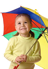 Image showing Cute child catching raindrops under umbrella