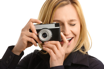 Image showing young woman taking a shot with photo camera