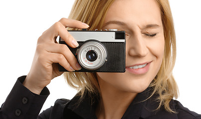 Image showing young woman taking a shot with photo camera