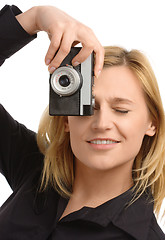 Image showing young woman taking a shot with photo camera