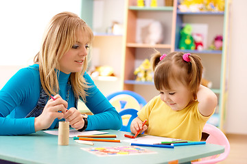 Image showing Teacher with child in preschool
