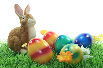 Image showing Easter bunny with eggs on a lawn