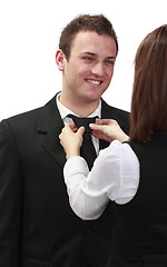 Image showing Woman Tying Man's Tie