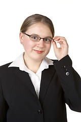 Image showing young business woman adjusting glasses 