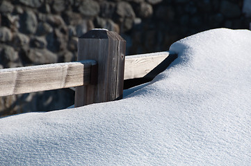 Image showing Fence covered by powder snow