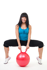 Image showing Young happy woman exercise with sport ball