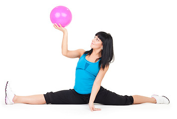 Image showing Woman exercise with ball doing splits