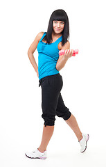 Image showing Fitness instructor stand with dumbbells