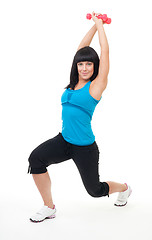 Image showing Young positive woman exercise with dumbbells