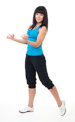 Image showing Young woman do fitness using dumbbells