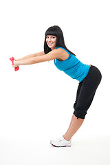 Image showing Woman stretching with dumbbells