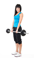 Image showing Happy woman lifting bar with weights