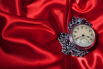 Image showing Old clock on red background