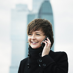Image showing Smiling woman on cellphone