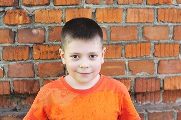 Image showing Boy at brick wall