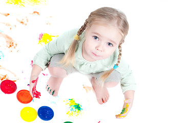 Image showing Little girl playing with colors