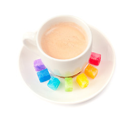 Image showing Multicolored slabs of shugar and cup of coffee 