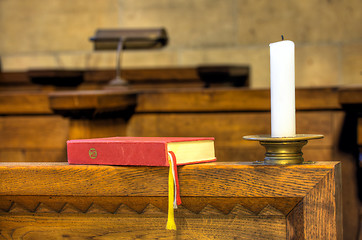 Image showing Detail of hymnal and candle