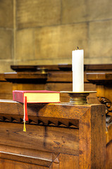 Image showing Detail of hymnal and candle