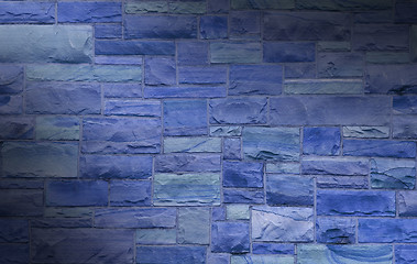 Image showing Blue masonry wall lit diagonally