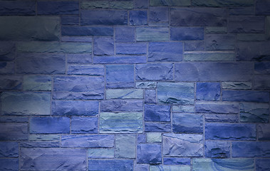 Image showing Blue masonry wall lit dramatically