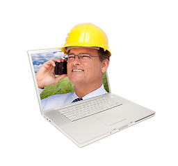 Image showing Laptop and Man with Hard Hat on Cell Phone