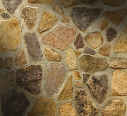 Image showing Masonry wall with irregular shaped stones 