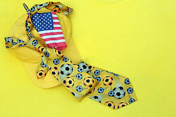 Image showing Yellow Baseball Cap, Necktie and US Flag