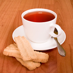 Image showing cup of tea and some cookies