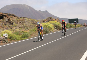 Image showing Group of cyclists in ironman 