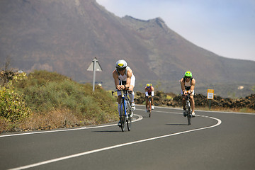 Image showing Group of cyclists in ironman 