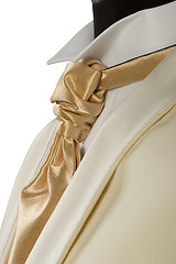 Image showing withe suit and gold tie