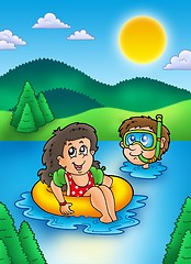 Image showing Two swimming kids in lake