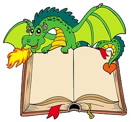 Image showing Green dragon holding old book