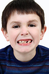 Image showing Young boy grimacing