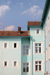 Image showing Exterior of building with red roof