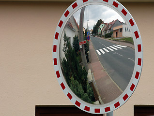 Image showing Mirror by the road for drivers to see behind the corner