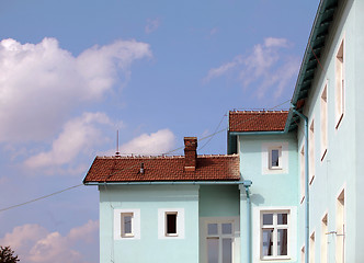 Image showing Exterior of building with red roof