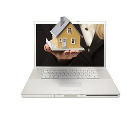 Image showing Woman Handing House Through Laptop Screen