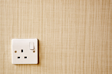 Image showing Power outlet at the corner of a wall