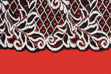 Image showing Black lace insulated on red background