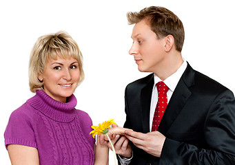 Image showing Man in suit presents daisywheel to woman