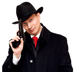 Image showing Man in suit, red tie with gun